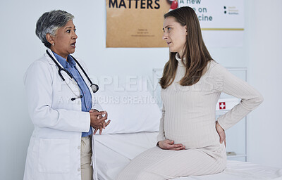 Buy stock photo Back pain, pregnant woman and doctor in hospital consultant, gynecology services and advice or support. Mother stomach, abdomen problem and pregnancy, medical gynecologist or people in clinic talking