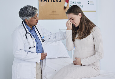 Buy stock photo Senior doctor, pregnant woman and headache in consultation, checkup or appointment at hospital. Mature female person, medical or healthcare expert checking patient in maternity or pregnancy at clinic