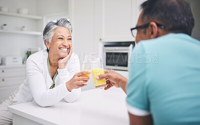 Buy stock photo Senior couple, smile and cheers in a kitchen with toast and love celebration drink. Home, juice and cocktail together of elderly man and woman happy of support and care with marriage and anniversary