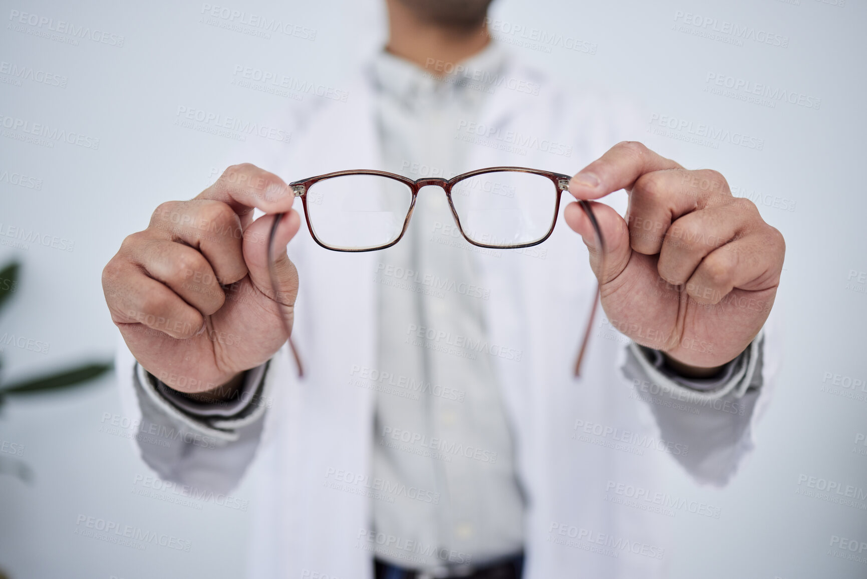 Buy stock photo Hands, person and optometrist with glasses for vision, eyesight and prescription eye care. Closeup of doctor, optician and frame of lens, eyewear test and consulting for optical healthcare assessment