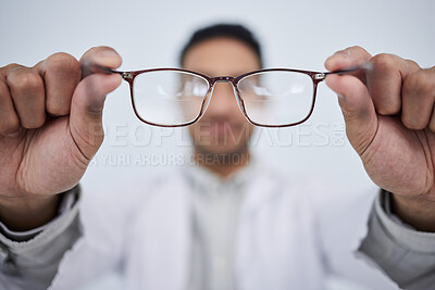 Buy stock photo Hands, man and optician with glasses for vision, eyesight and eye care prescription lens. Closeup of doctor, optometrist and frame for eyewear, test and consulting for optical assessment in clinic 