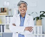 Happy senior woman, portrait and doctor with arms crossed in confidence for healthcare at the office. Excited, confident and mature female person or medical professional with smile at the clinic