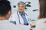 Senior woman, doctor and couple in consultation for healthcare advice or life insurance at hospital. Happy mature female person or medical professional in meeting, discussion or consulting patients