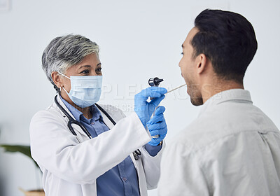 Buy stock photo Woman, doctor and face mask with patient for checkup, exam or healthcare appointment at the hospital. Female person or medical professional with protection checking ill or sick man with flu at clinic