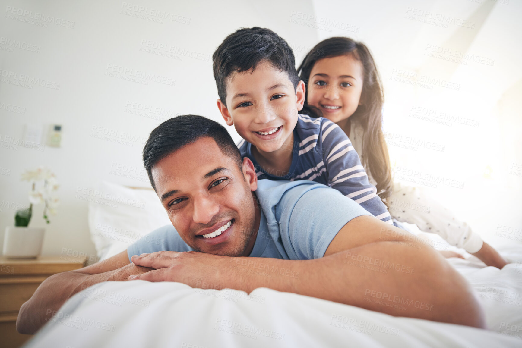 Buy stock photo Family, portrait and play with fun and smile in a home with bonding and parent care. Happy, house and bedroom with a father and young children together in the morning with dad and kids with youth