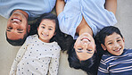 Above, portrait and happy family on a floor relax, bond and playing in their home on the weekend. Face, smile and top view of children with young parents in a bedroom with love, fun and chilling