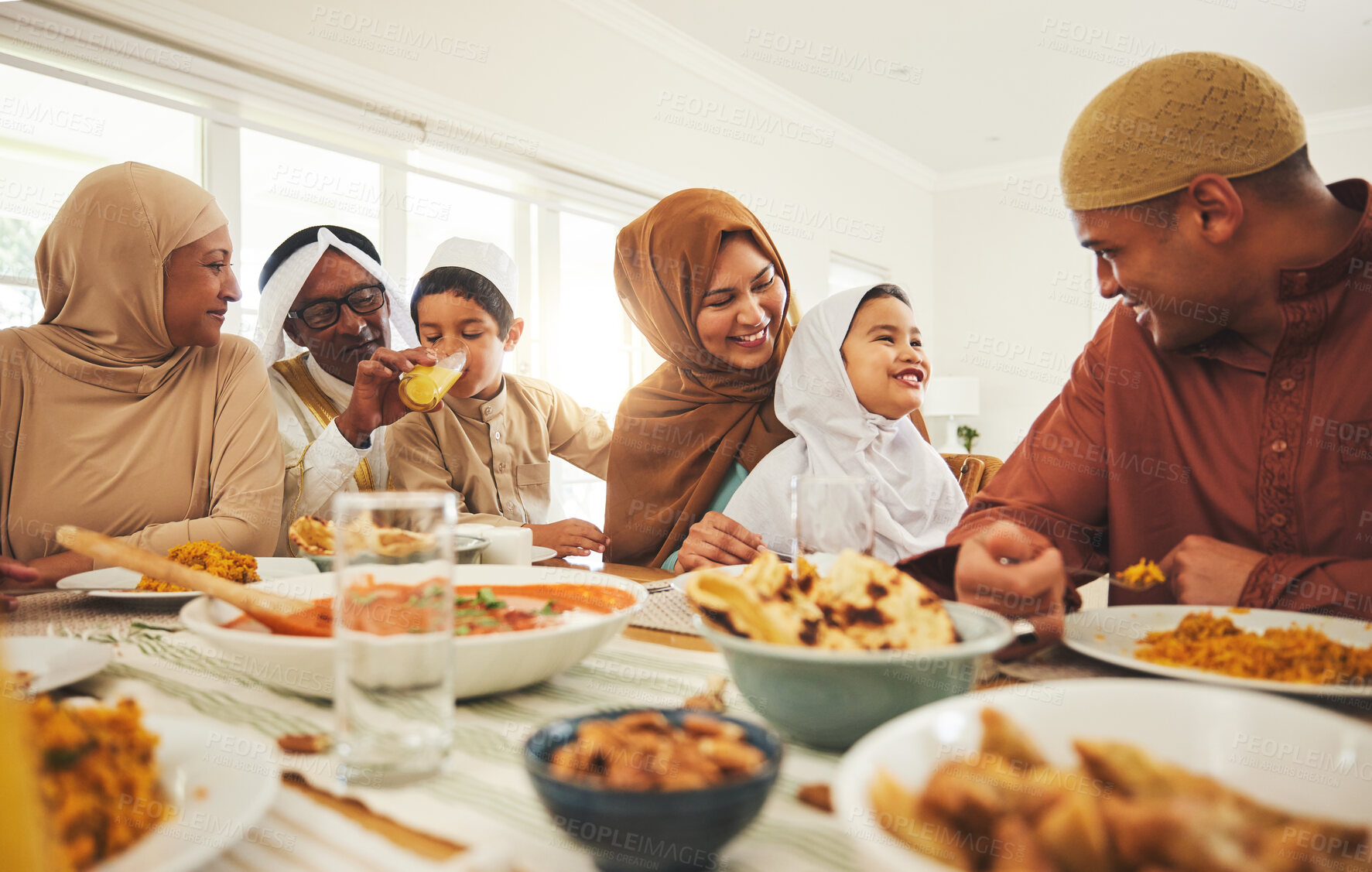Buy stock photo Food, happy and muslim with big family at table for eid mubarak, Islamic celebration and lunch. Ramadan festival, culture and iftar with people eating at home for fasting, islam and religion holiday