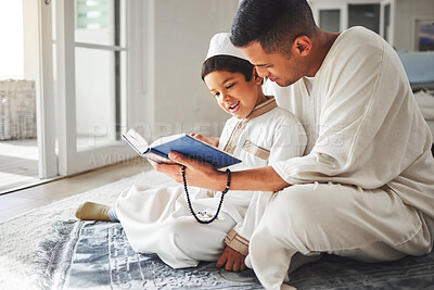 Buy stock photo Quran, Muslim and father and happy kid praying to Allah, god or holy spirit for Arabic religion, faith and reading spiritual book. Prayer beads, home family study and Islamic dad teaching youth child