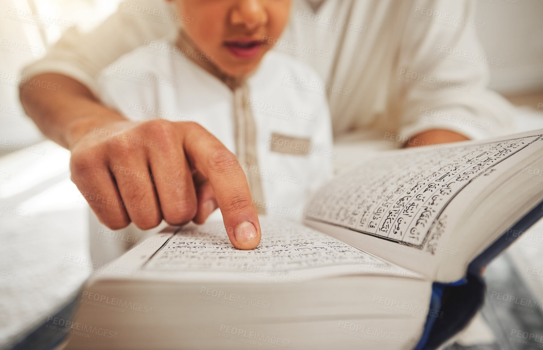 Buy stock photo Quran, Islam child or parent hands reading for religion learning, muslim pray and faith in Allah, god or holy spirit. Child development, home education or closeup father teaching kid spiritual book