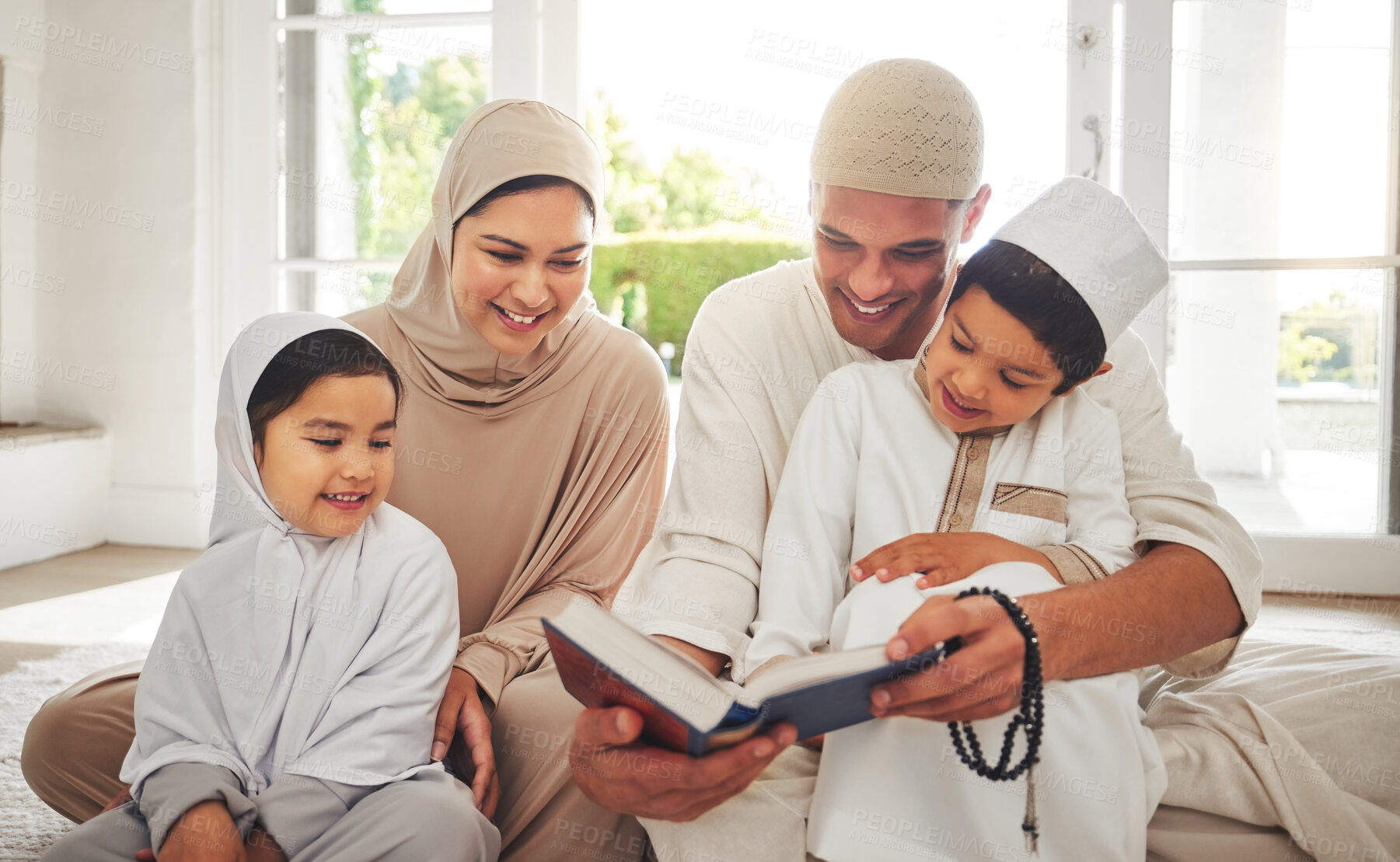 Buy stock photo Happy family, Muslim parents or children reading book for learning, Islamic knowledge or studying in Allah or God. Support, dad or Arabic mom teaching kids worship, prayer or holy Quran at home 