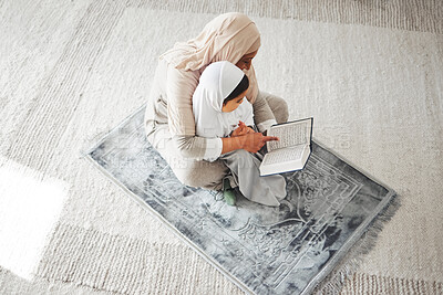 Buy stock photo Quran, Muslim kid and parent on floor reading, learning and help girl with religion prayer, study and faith in Allah. Knowledge books, home top view or person teach child worship, praying and respect