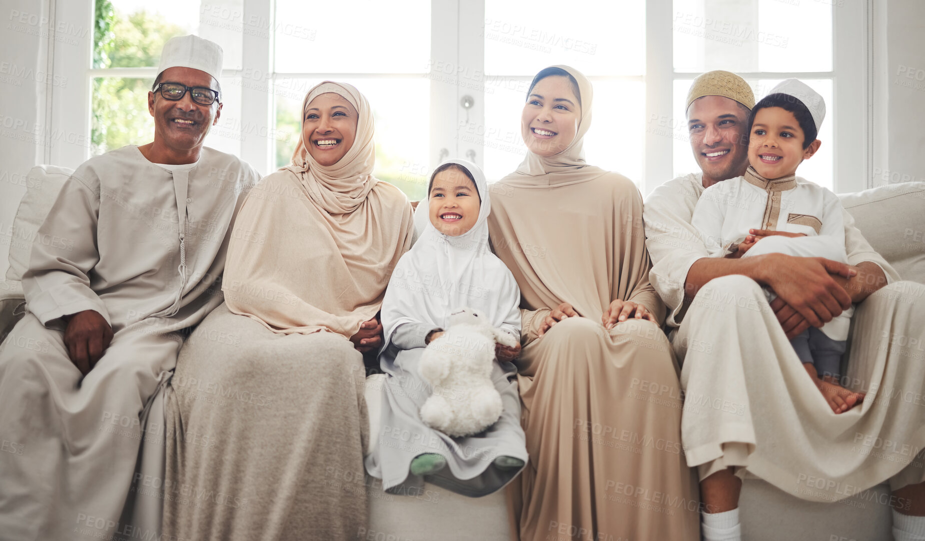 Buy stock photo Smile, Islam and big family on sofa for Eid with parents, grandparents and kids for home culture in Indonesia. Muslim men, women in hijab and children, generations celebrate Ramadan on couch together