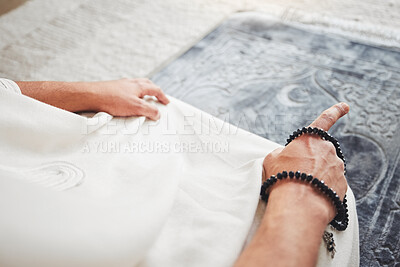 Buy stock photo Prayer, muslim and worship with hand of man on living room floor for eid mubarak, God and islamic. Quran, hope and Ramadan with closeup of person praying at home for faith, religion and gratitude