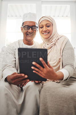Buy stock photo Tablet video call, Muslim and happy elderly couple talking, speaking and on online communication. Global networking, Islam home and Arab man, woman or senior people consulting on virtual conversation