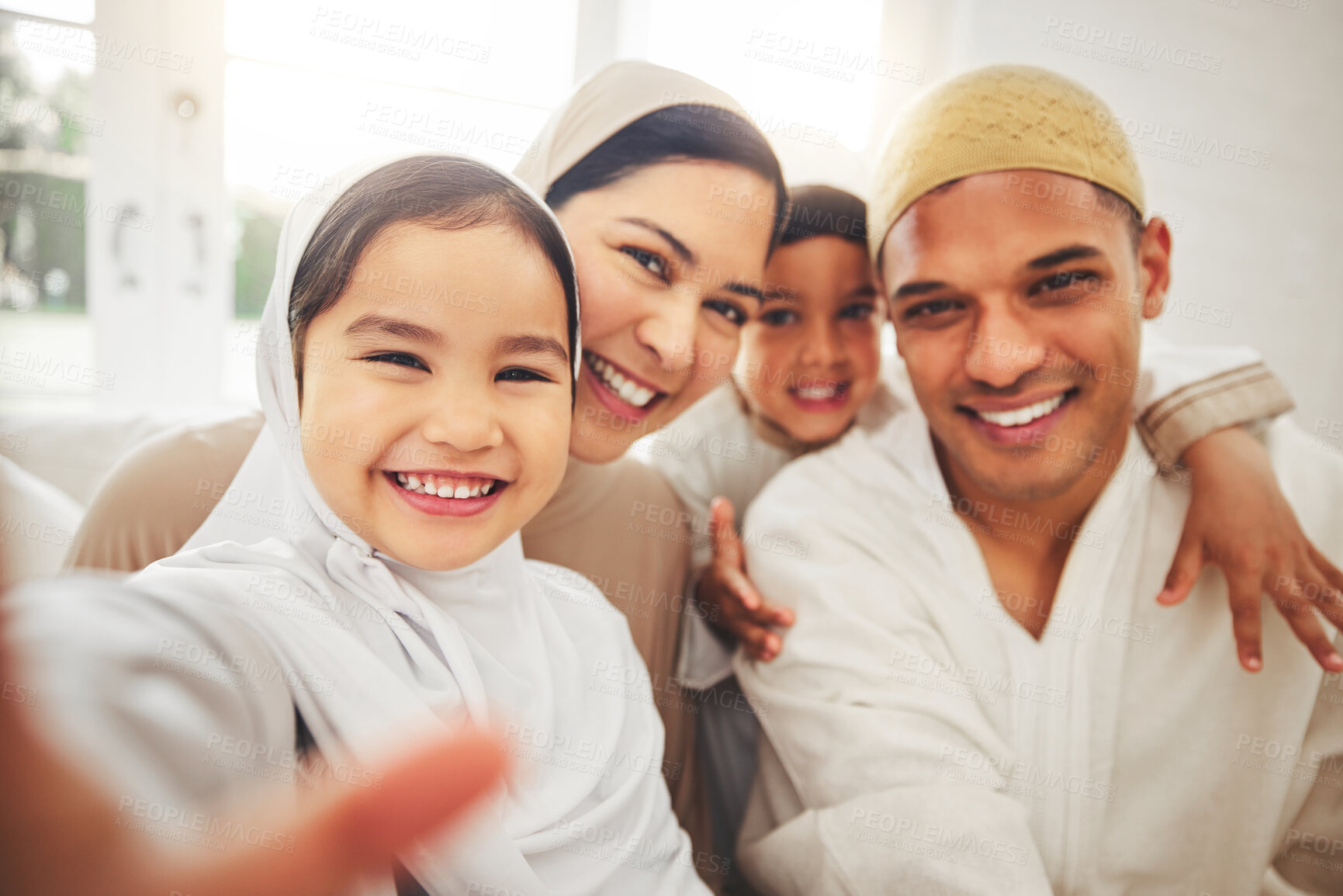 Buy stock photo Selfie, Islam and happy family in living room for Eid with mom, dad and kids with home culture in Indonesia. Muslim man, woman in hijab and children in portrait to celebrate Ramadan on sofa together.