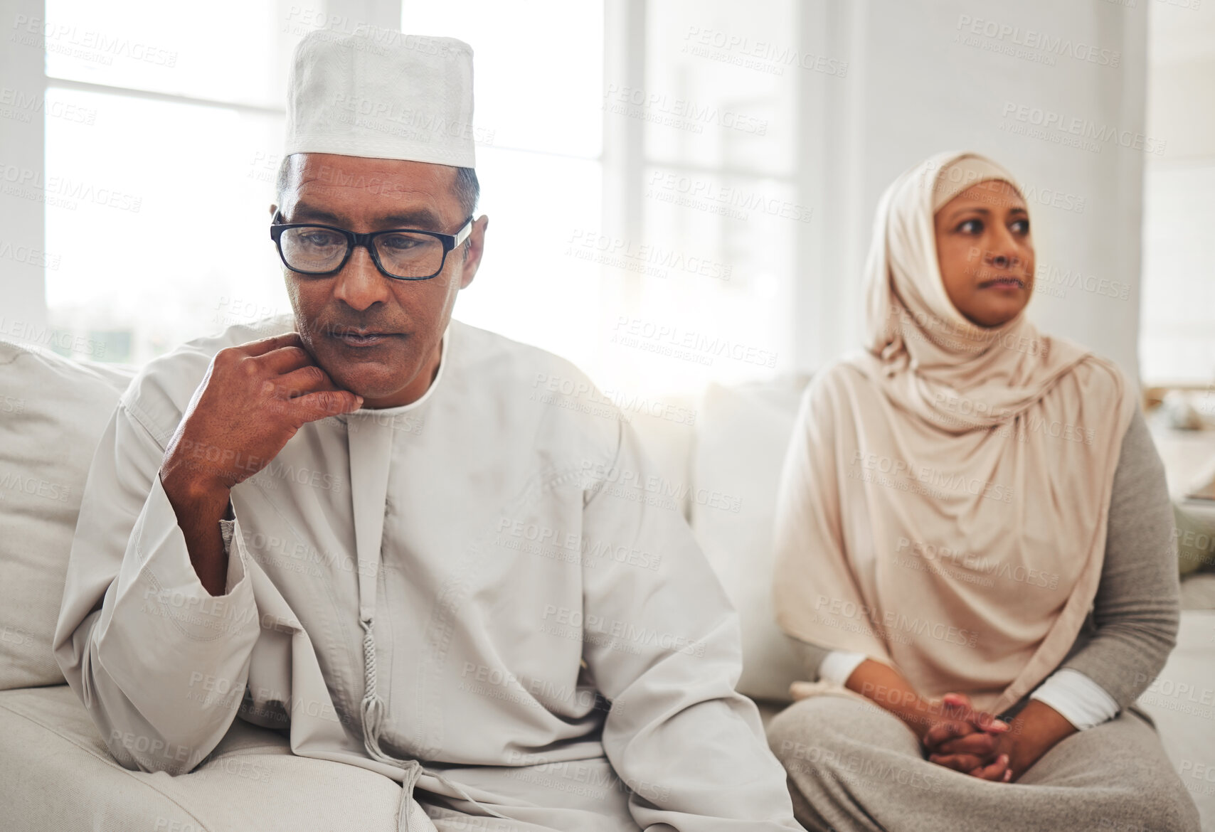 Buy stock photo Muslim couple, fight or mature man with depression, problem or divorce conflict in home living room. Sad, crisis or marriage fail for thinking Islamic people in house stress, mental health or anxiety