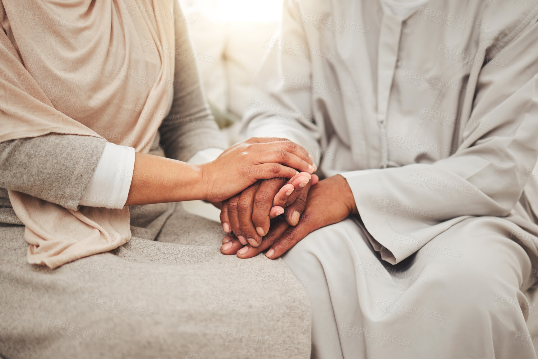 Buy stock photo Muslim couple, hands together for support and empathy with care and love, solidarity and trust in relationship. Help, comfort and bonding with commitment in Islam, people in marriage with respect