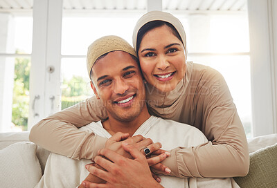 Buy stock photo Portrait, Islam and happy couple hug on couch with smile, culture and love in home in Turkey. Face of Muslim man, woman in hijab and happiness in marriage on sofa, together in respect and religion.
