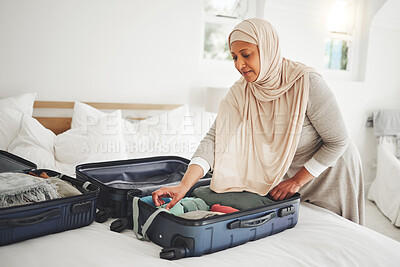 Buy stock photo Travel, bedroom and Muslim woman with suitcase packing for holiday, vacation and religious trip. Home, luggage and Islamic female person with clothes in bag prepare for journey, adventure and tourism