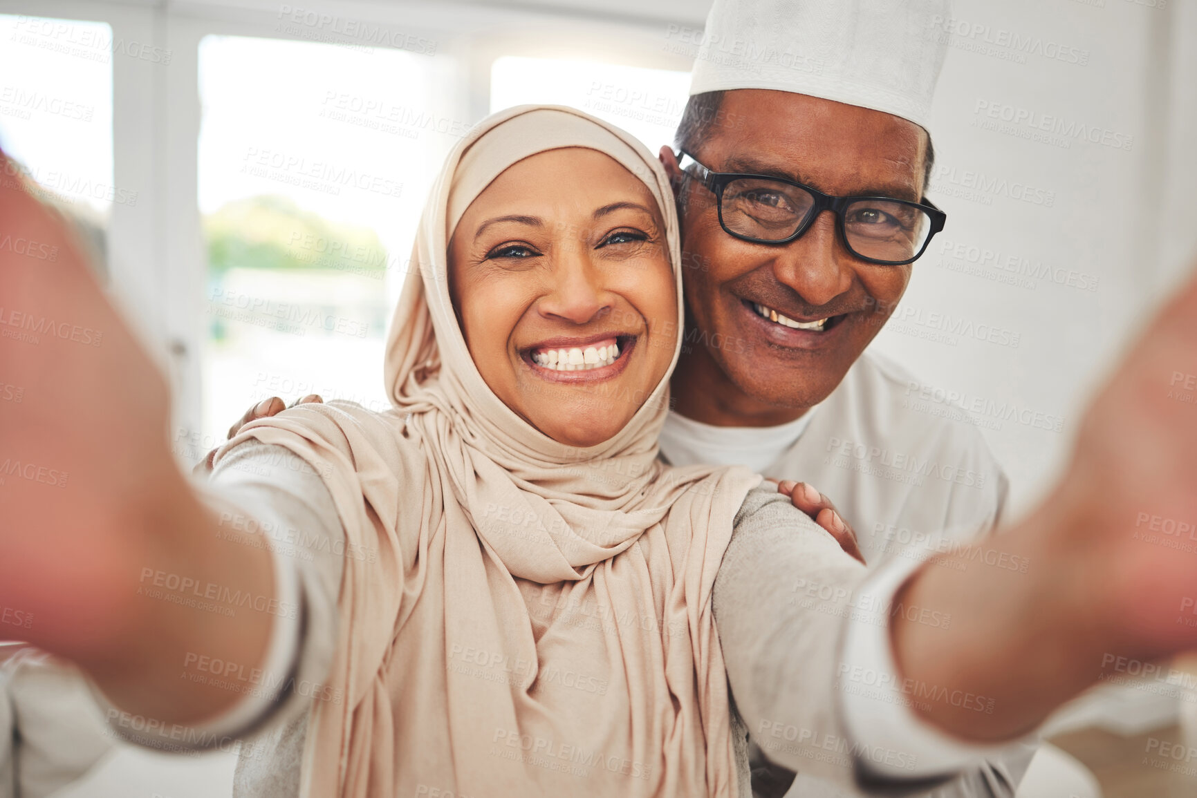 Buy stock photo Selfie, Islam and old couple in home with smile, happy culture and love in living room in Indonesia. Marriage, senior man and woman in hijab on sofa in respect, religion and face for social media.