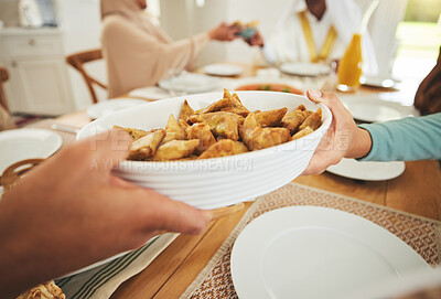 Buy stock photo Food, samosa and muslim with hands of family at table for eid mubarak, Islamic celebration and lunch. Ramadan festival, culture and iftar with closuep of people at home for fasting, islam or religion