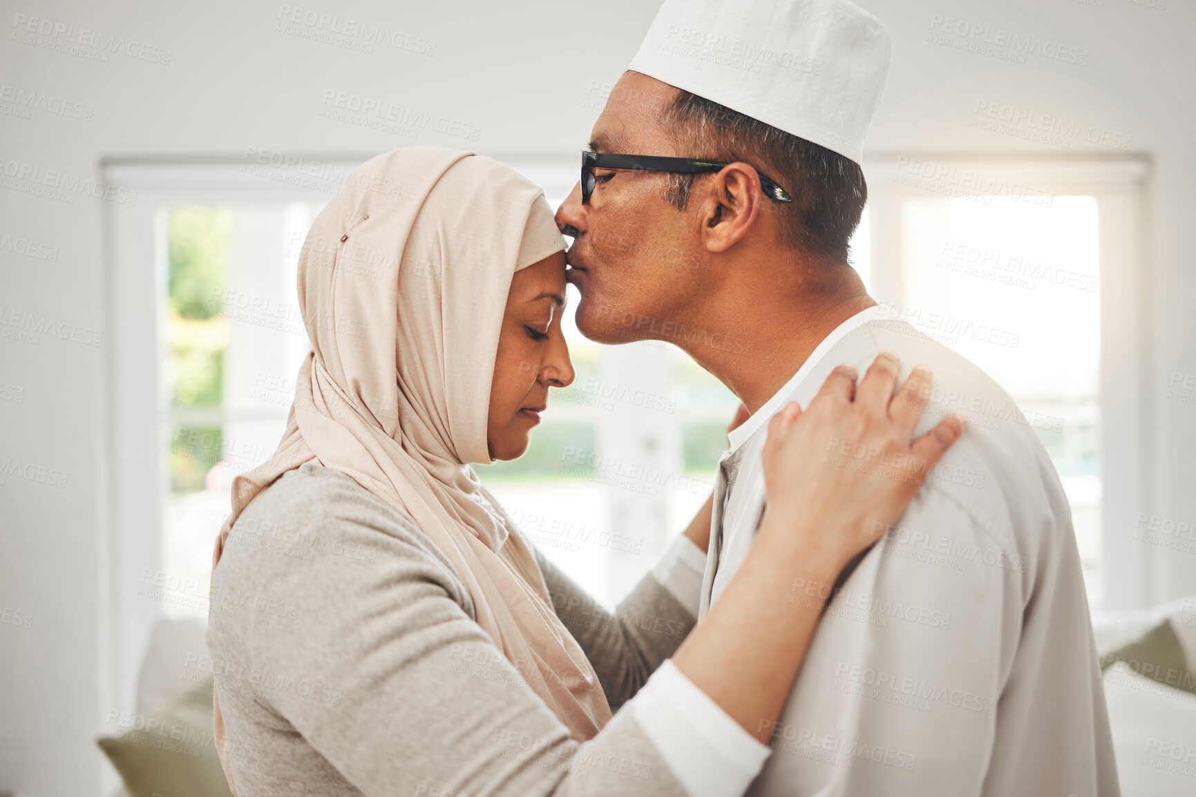 Buy stock photo Home, Muslim elderly couple and forehead kiss, music slow dancing and bond for love, trust and care with kindness. Commitment, Islamic and Arab man, woman and senior people together for quality time