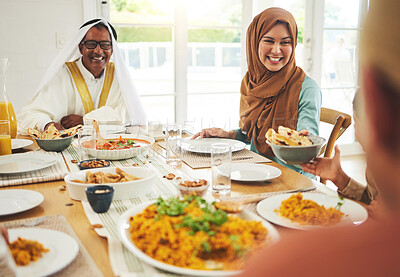 Buy stock photo Food, help and muslim with big family at table for eid mubarak, Islamic celebration and lunch. Ramadan festival, culture and iftar with people eating at home for fasting, islam and religion holiday