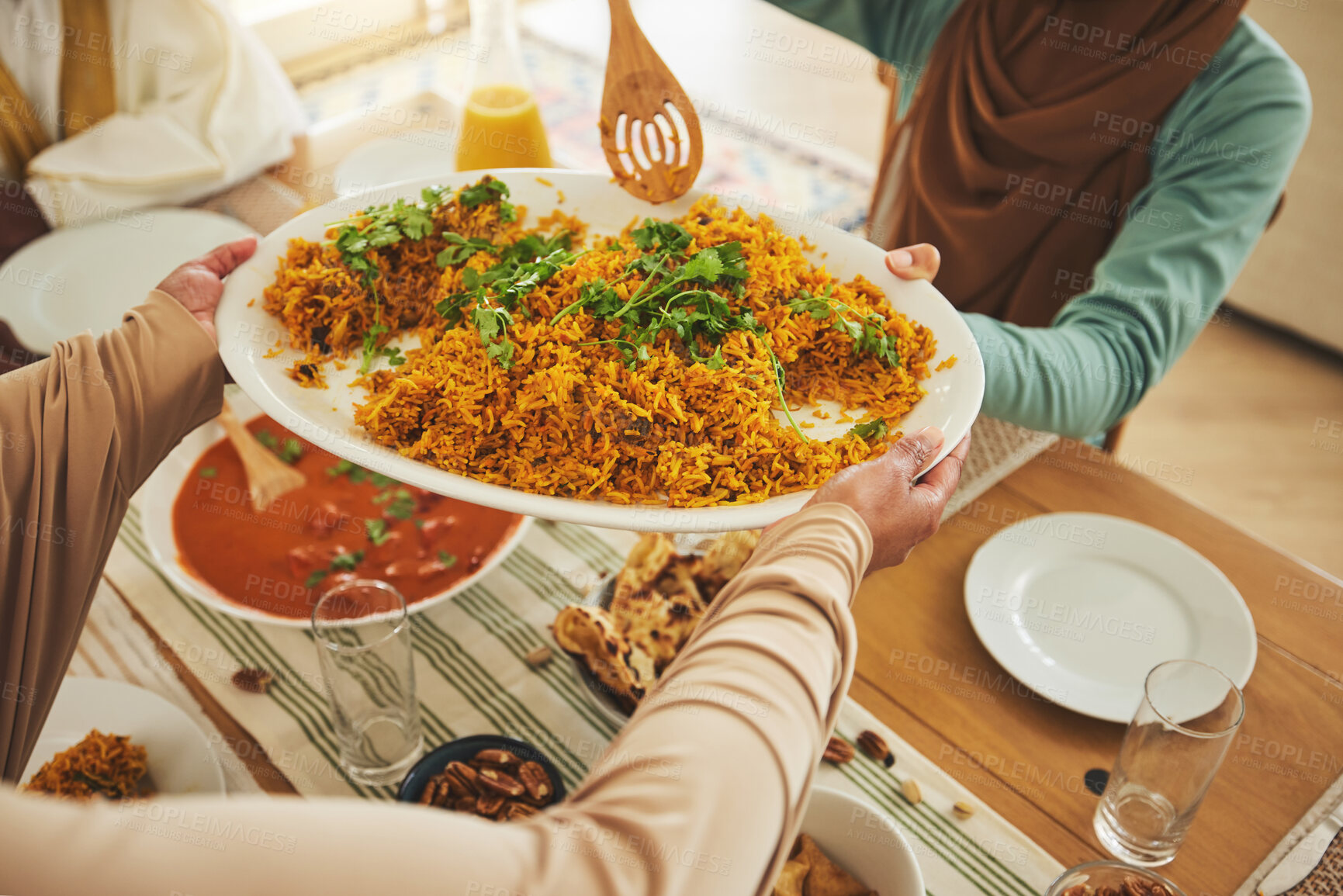 Buy stock photo Culture, Eid Mubarak and food for family at table for Islamic celebration, festival and lunch together. Ramadan, religion and above of hands with meal, dish and cuisine for fasting, holiday and feast