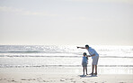 Beach, pointing and family father and child relax, enjoy outdoor wellness, and freedom Brazil vacation. Ocean sea water, mockup sky and back of family, dad and young kid gesture at nature