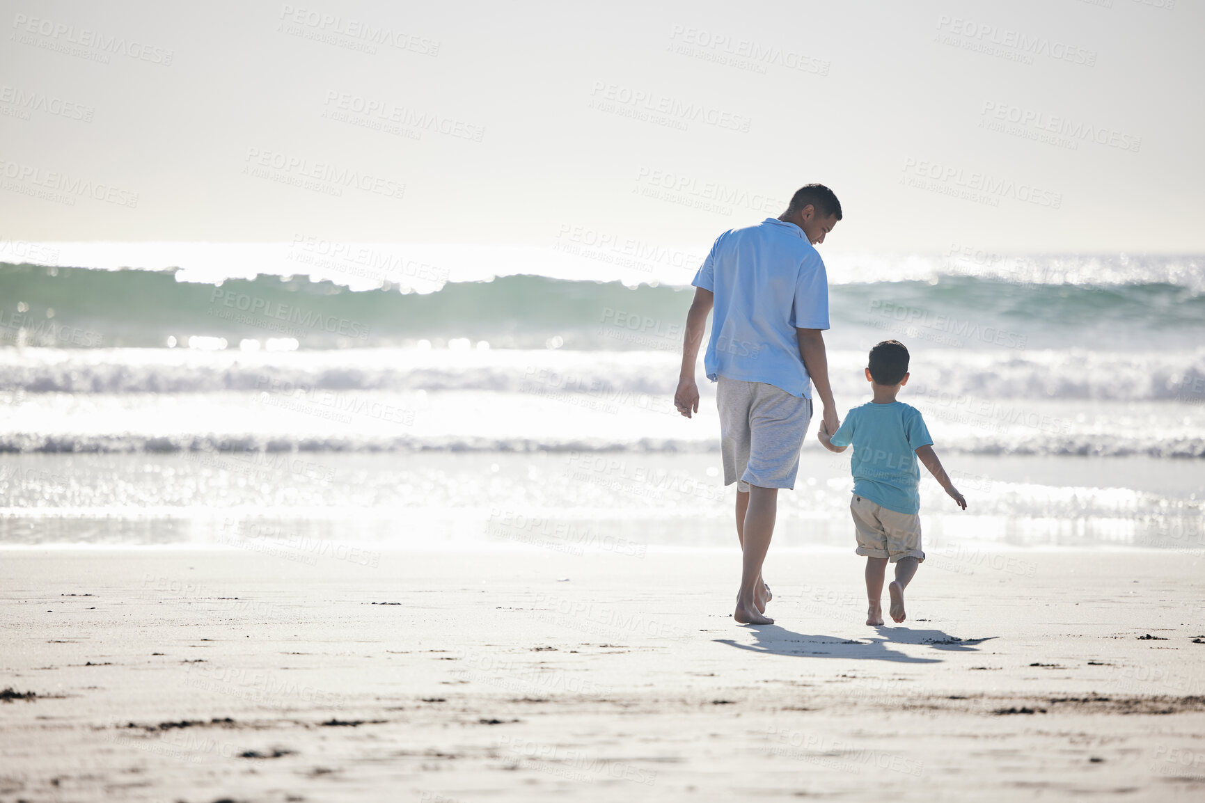 Buy stock photo Beach, holding hands and father and  child walking for outdoor wellness, freedom and fresh air on Brazil vacation. Ocean sea water, mockup and back of family, dad and young kid bonding on travel