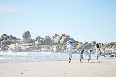 Buy stock photo Family, holding hands and walking on beach together for weekend, vacation or holiday on mockup space. Mother, father and children enjoying summer walk on the ocean coast in travel, bonding or getaway