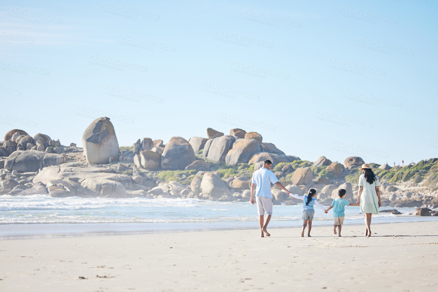 Buy stock photo Family, holding hands and walking on beach together for weekend, vacation or holiday on mockup space. Mother, father and children enjoying summer walk on the ocean coast in travel, bonding or getaway