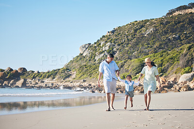Buy stock photo Beach, mother and father holding hands with a child for fun, family adventure and play on holiday. A happy woman, man and young kid walking on sand for vacation at ocean, nature or outdoor in summer