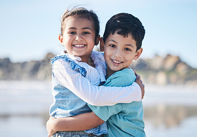 Buy stock photo Portrait, brother and girl in hug on the beach as children on holiday or vacation during family summer on a blurred background. Smile, love and siblings with kids bonding outdoor in nature together