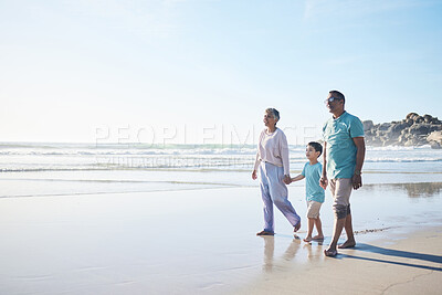 Buy stock photo Beach, walking and senior couple with boy for bonding, quality time and relaxing in nature. Family, travel and happy elderly man and woman with child by ocean on holiday, vacation and adventure