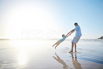 Buy stock photo Family, father and spinning a child at the beach for fun, adventure and play on holiday. A man and young kid holding hands on vacation at the ocean, nature or outdoor with mockup banner space in sky