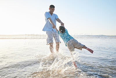 Buy stock photo Beach, family and father and spinning a child for fun, adventure and play on holiday. A man and young kid holding hands on vacation at the ocean, nature or outdoor with water splash and freedom