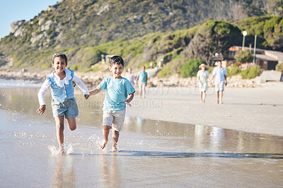 Buy stock photo Kids, brother and sister running at beach, excited and holding hands with smile, adventure and vacation. Young children, happy and playful with race, games and freedom by ocean for summer in Hawaii