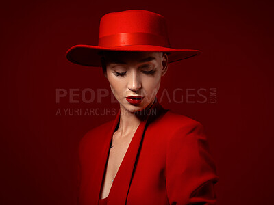 Buy stock photo Beauty, fashion and a model woman on red background in studio for elegant or trendy style. Aesthetic, art and confident with an edgy or classy young female person eyes closed in a unique clothes suit