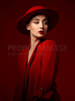 Buy stock photo Idea, fashion and woman in red hat in studio isolated on a background with suit. Makeup, cosmetics and female model in fedora, serious style and classy clothes with aesthetic, vision and thinking.