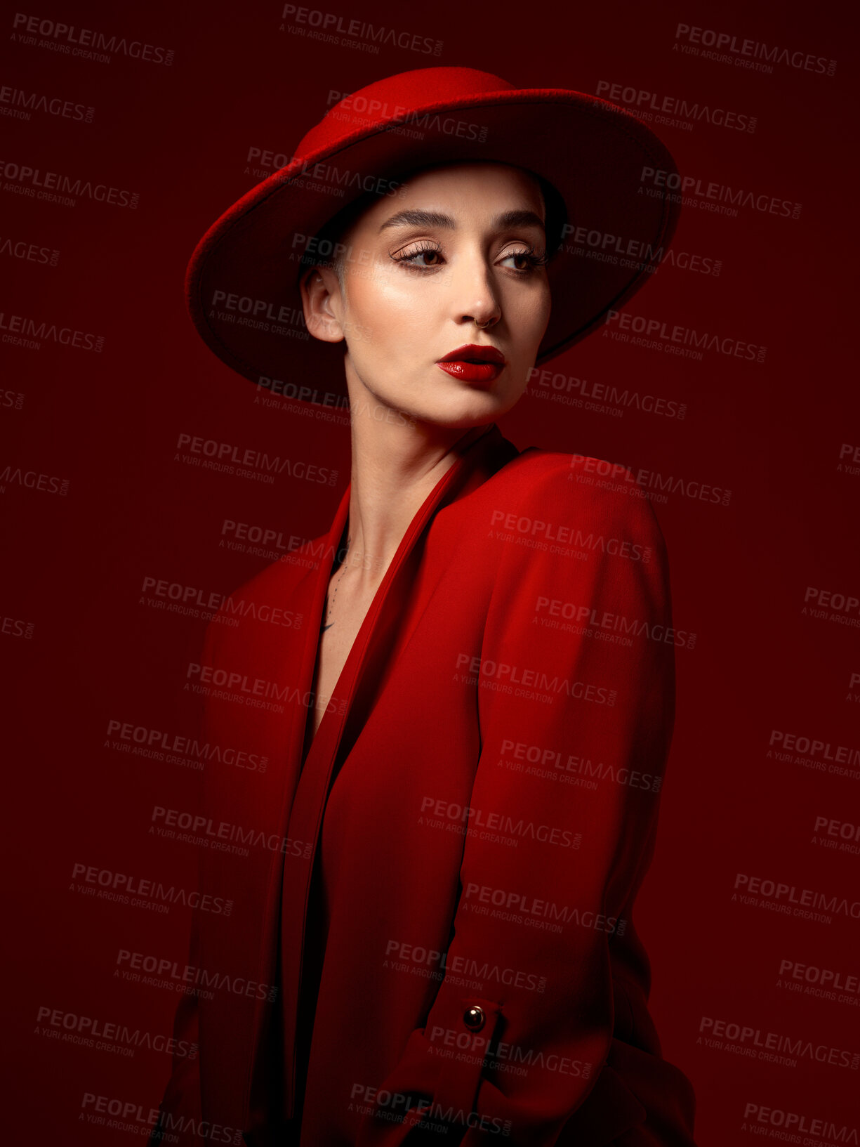 Buy stock photo Idea, fashion and woman in red hat in studio isolated on a background with suit. Makeup, cosmetics and female model in fedora, serious style and classy clothes with aesthetic, vision and thinking.