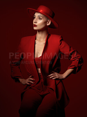 Buy stock photo Vision, fashion and a woman thinking on a red studio background for elegant or trendy style. Aesthetic, future and beauty with a young female model standing hands on hips while looking edgy or classy