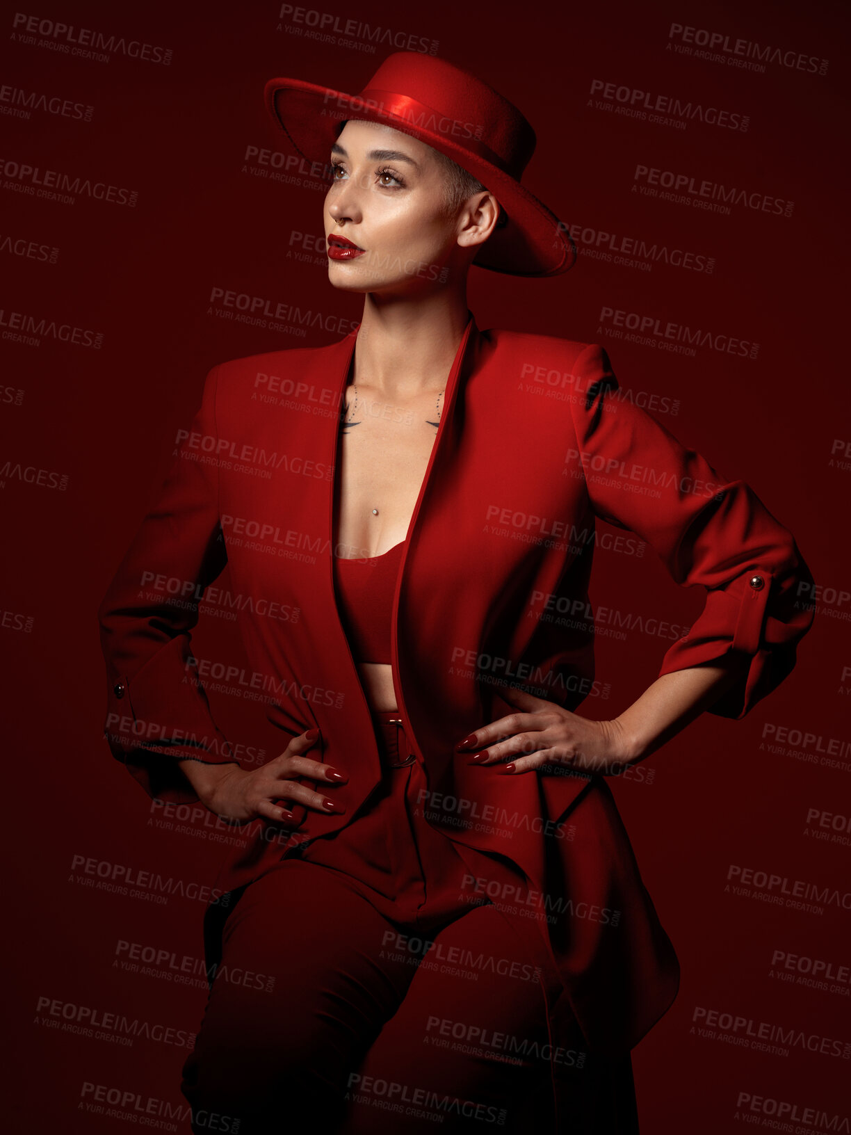 Buy stock photo Vision, fashion and a woman thinking on a red studio background for elegant or trendy style. Aesthetic, future and beauty with a young female model standing hands on hips while looking edgy or classy