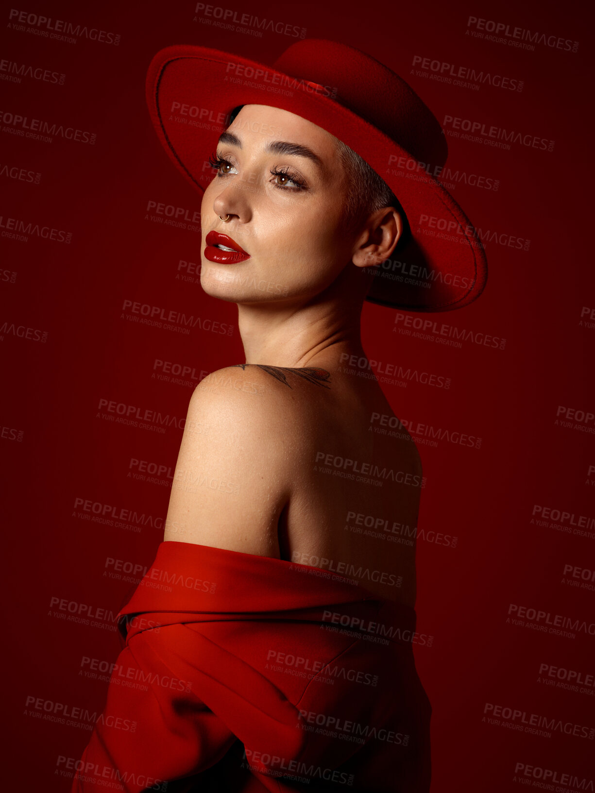 Buy stock photo Mindset, fashion and a model woman on a red studio background for elegant or trendy style. Future, vision and beauty with a young female person thinking in an edgy or classy outfit for aesthetic art