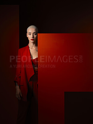 Buy stock photo Portrait, fashion and mockup with a woman on a dark background in studio for marketing, advertising or branding. Luxury, aesthetic style or a trendy young female model standing with a blank poster