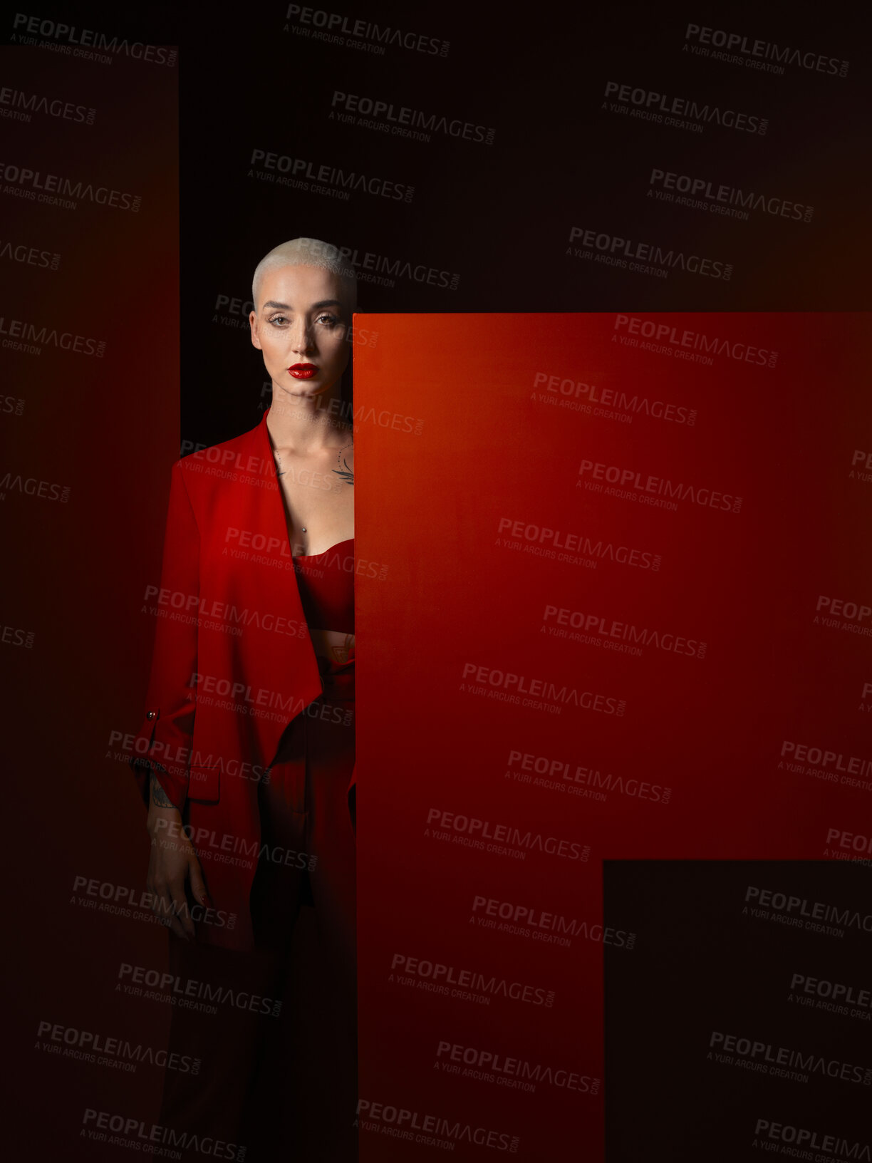 Buy stock photo Portrait, fashion and mockup with a woman on a dark background in studio for marketing, advertising or branding. Luxury, aesthetic style or a trendy young female model standing with a blank poster