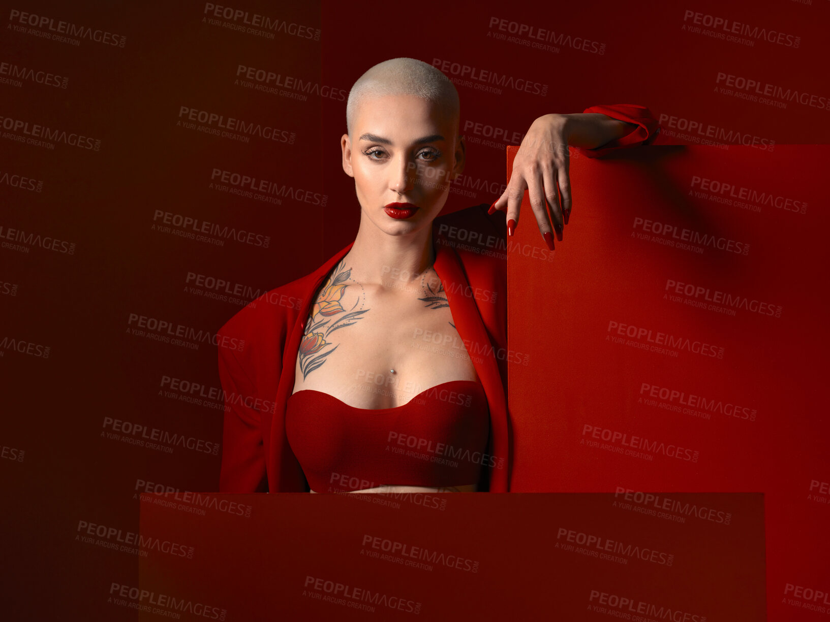 Buy stock photo Fashion, portrait and confident woman in red suit in studio isolated on a background mockup space. Face, makeup and serious female model with cosmetics, aesthetic or classy clothes from Switzerland.