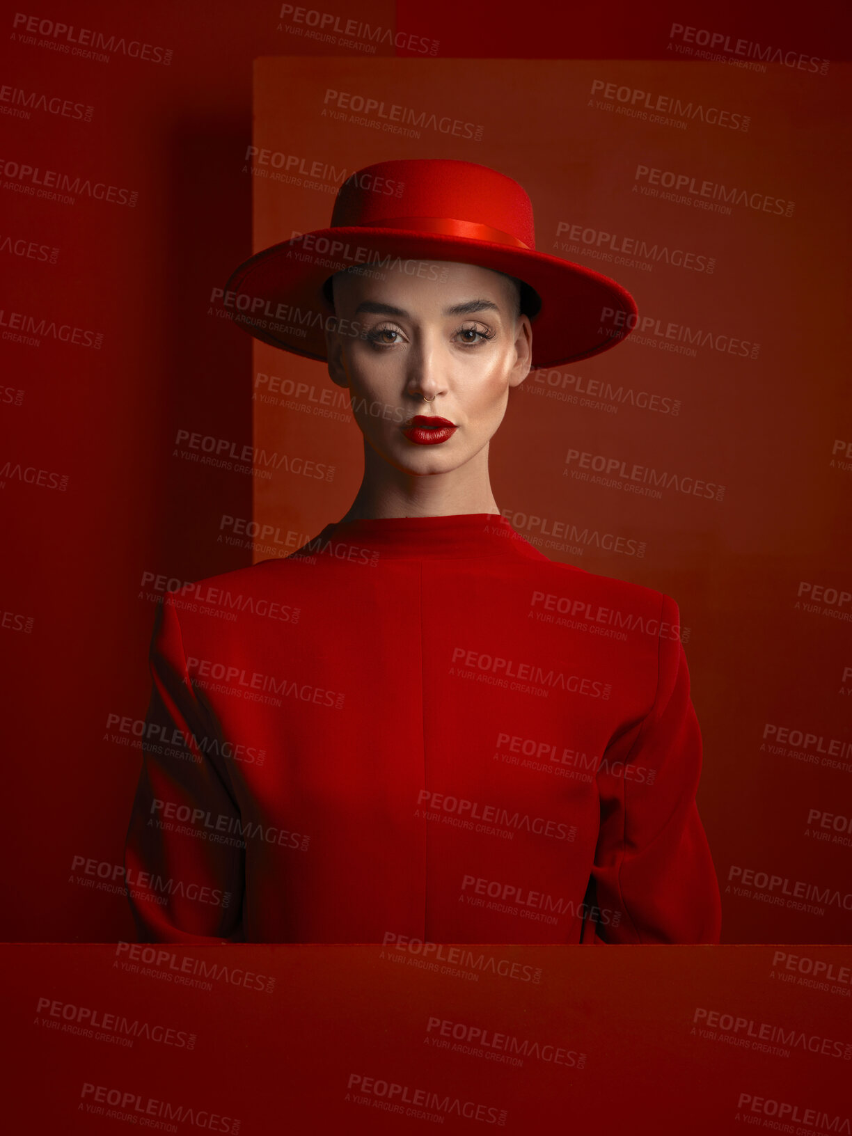 Buy stock photo Portrait, fashion and space with a woman in red on a studio background for marketing, advertising or branding. Reverse, style or a trendy young female person standing with empty or blank mockup