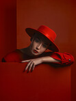 Fashion, portrait and a vintage woman on a red background for a sexy or creative aesthetic. Retro, rich and an elegant, classy or stylish model or girl with cosmetics isolated on a studio backdrop