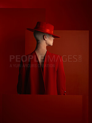 Buy stock photo Back, fashion and mockup with a woman on a red background in studio for marketing, advertising or branding. Hat, aesthetic style or a trendy young female person standing with an empty or blank poster